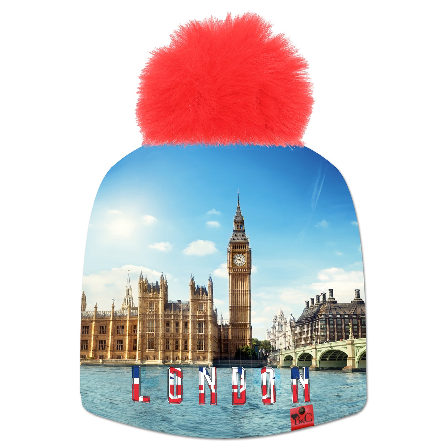 Bonnet Churchill pour enfants avec le palais de Westminster en fond et l'inscription "London" en rouge, blanc, bleu. Le bonnet est accompagné de son pompon Rouge en fourrure synthétique et de son étiquette en cuir rouge signée Beanie and Clyde.