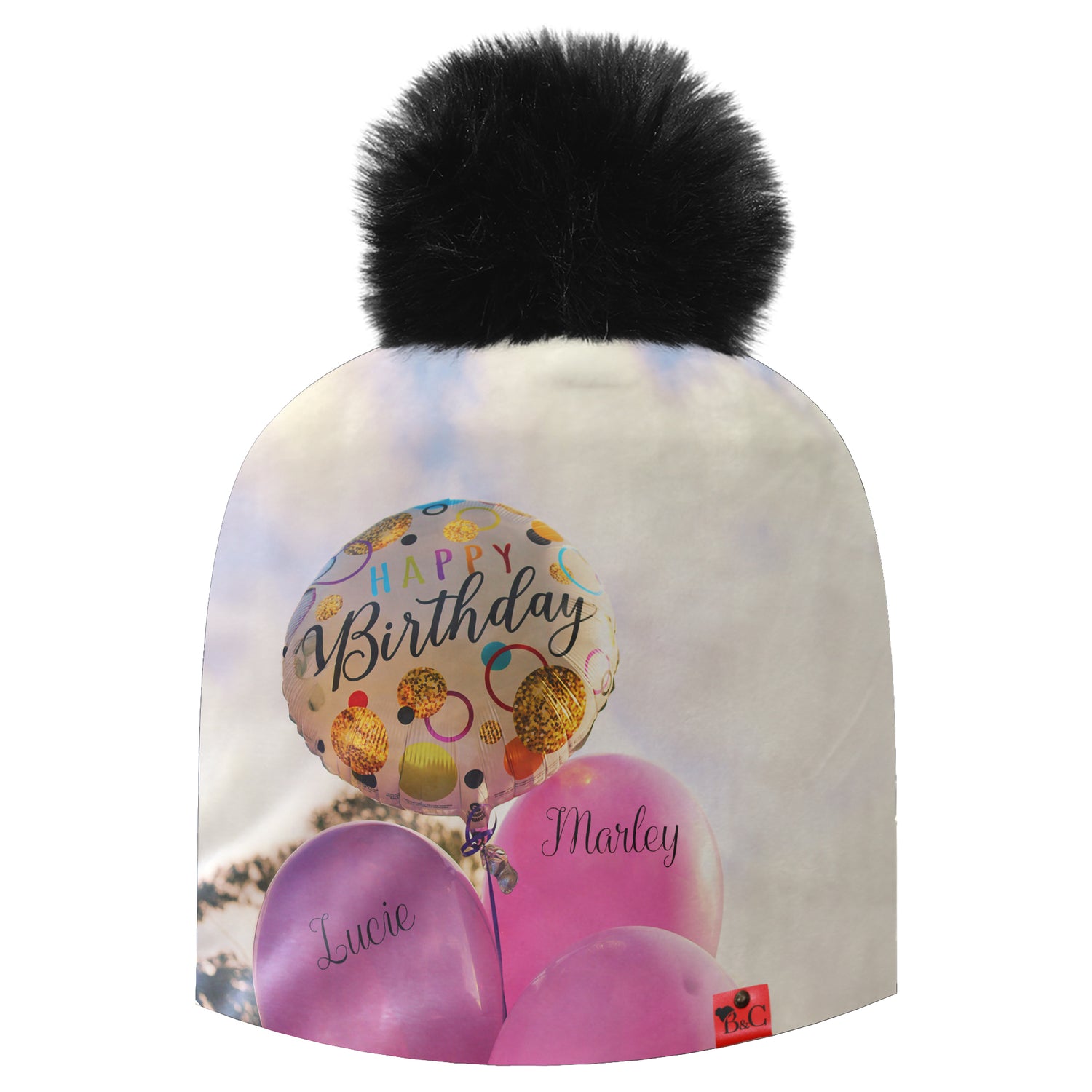 Bonnet signé Beanie and Clyde avec un imprimé de ballons roses et Happy Birthday.