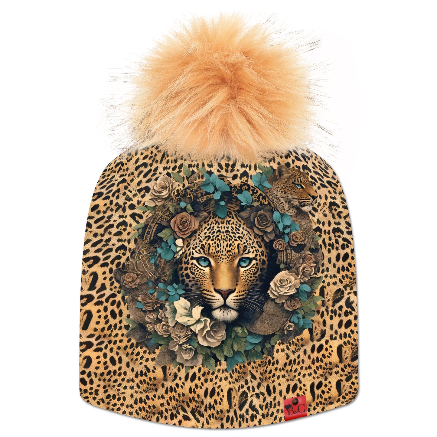Bonnet Taylor pour enfants, avec son imprimé leopard, avec en point central une tête de leopard entouré d'une couronne fleurie. Sublimé par son pompon Furet en fourrure synthétique et de son étiquette en cuir synthétique rouge signée Beanie and Clyde.