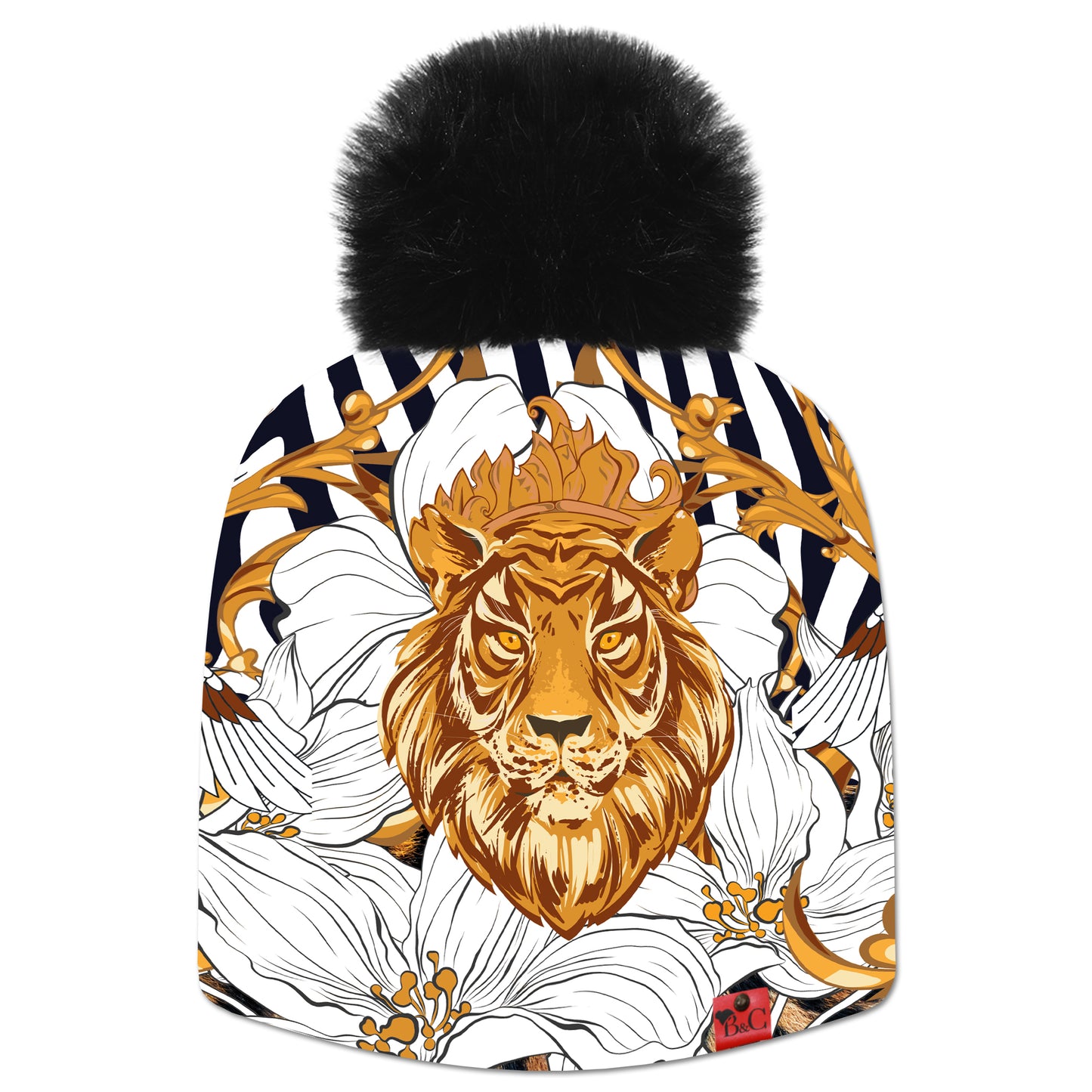 Bonnet Willis pour enfants, avec un motif de feuilles d'or, de signes, de fleurs, avec en point central une tête de lion dorée. Son pompon synthétique noir le sublime ainsi que son étiquette en cuir synthétique rouge signée Beanie and Clyde.