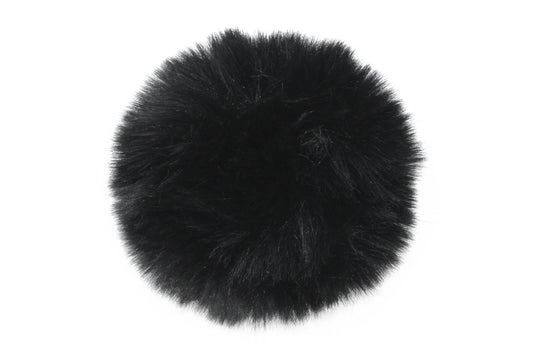 Pompon noir, au ton classique et polyvalent, avec une texture douce et raffinée, idéal pour apporter une touche chic et intemporelle à votre bonnet.